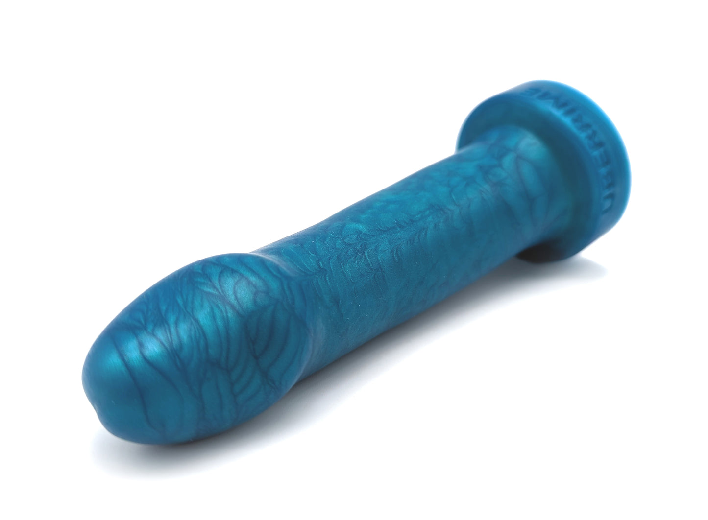 A beginner-friendly silicone dildo laying on its side. There’s a swirly effect to the silicone pigmentation. The toy’s flared base is round.